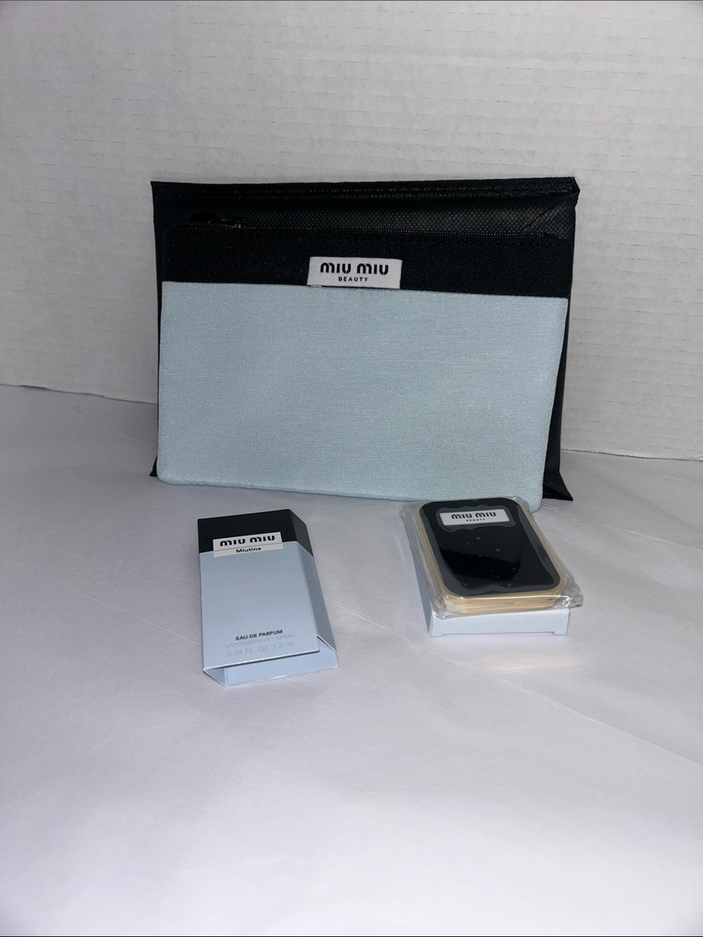 Miu Miu Black and Light Blue Beauty Pouch, Compact mirror, & Perfume Sample